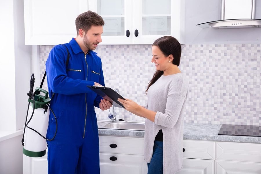 Licensed Orented Pest Control technician performing a pest inspection for a homeowner in Vaughan, ON